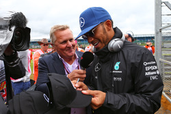 Lewis Hamilton, Mercedes AMG F1 with Johnny Herbert, Sky Sports F1 Presenter on the drivers parade