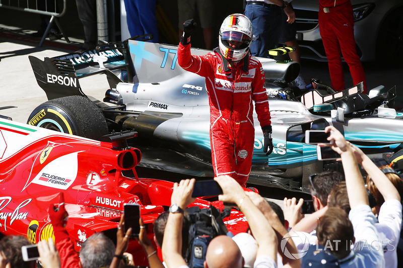 Sebastian Vettel, Ferrari SF70H, celebrates after winning the race