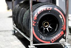 Red, soft, Pirelli tyres in a trolley rack