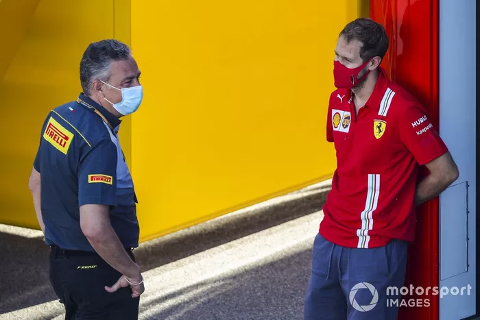 Mario Isola, Racing Manager, Pirelli Motorsport e Sebastian Vettel, Ferrari 