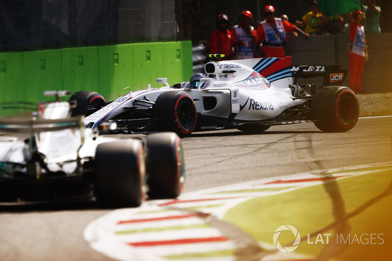 Lewis Hamilton, Mercedes AMG F1 W08, passes a spinning Lance Stroll, Williams FW40