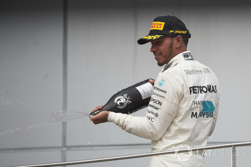 second place Lewis Hamilton, Mercedes AMG F1, sprays Champagne on the podium