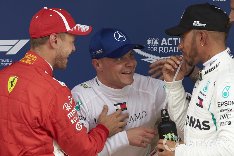 Top three Qualifiers Sebastian Vettel, Ferrari, Valtteri Bottas, Mercedes AMG F1, and Lewis Hamilton, Mercedes AMG F1