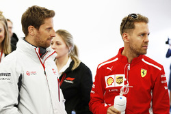 Romain Grosjean, Haas F1 Team, and Sebastian Vettel, Ferrari