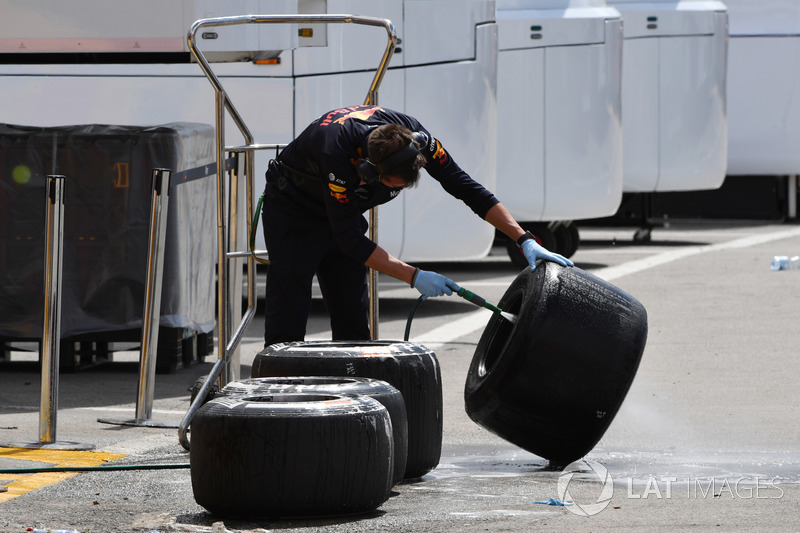 Red Bull Racing mechanic washes Pirelli tyres