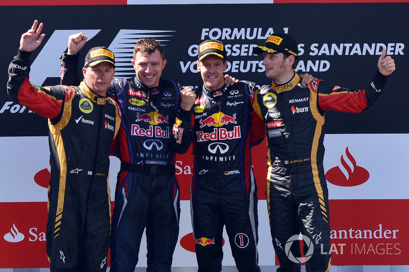 Kimi Raikkonen, Lotus F1, Joe Robinson, Red Bull Racing Mechanic, Sebastian Vettel, Red Bull Racing and Romain Grosjean, Lotus F1 celebrate on the podium