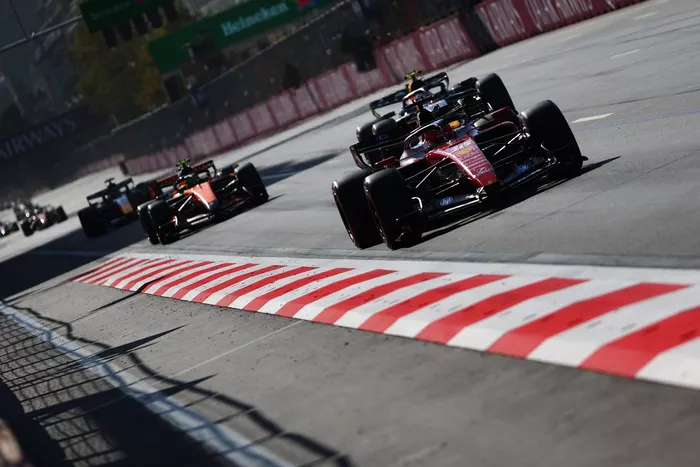 Charles Leclerc, Ferrari, Lando Norris, McLaren, Isack Hadjar, Red Bull Racing