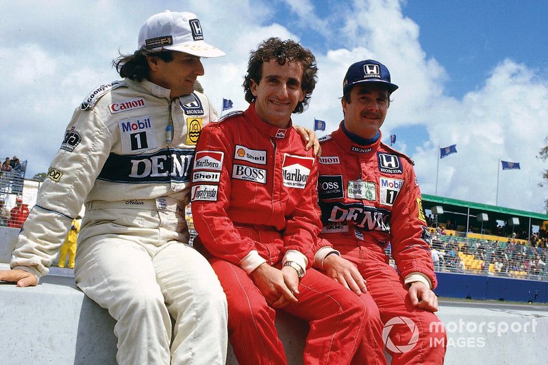 Nelson Piquet, Williams Honda, Alain Prost, McLaren TAG Porsche, Nigel Mansell, Williams Honda, on the pit wall.