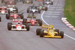 Ayrton Senna, Lotus 99T Honda, leads Alain Prost, McLaren MP4/3 TAG Porsche, and Gerhard Berger, Ferrari F187, at the start