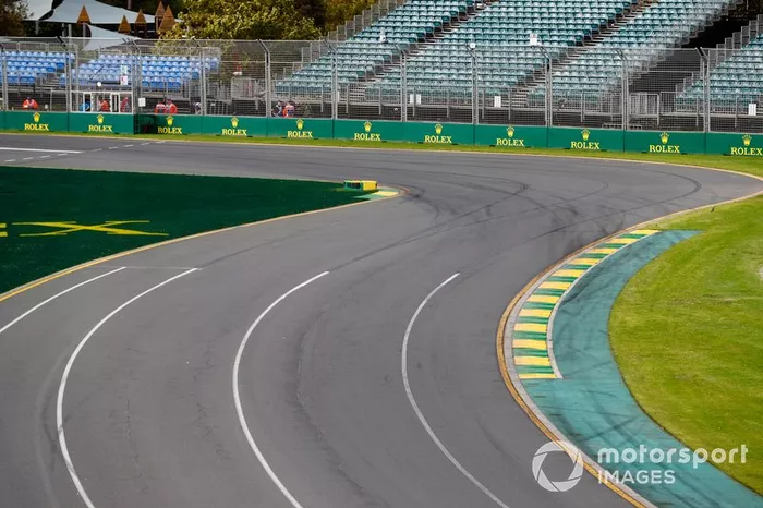 Empty track and grandstands at turn 1