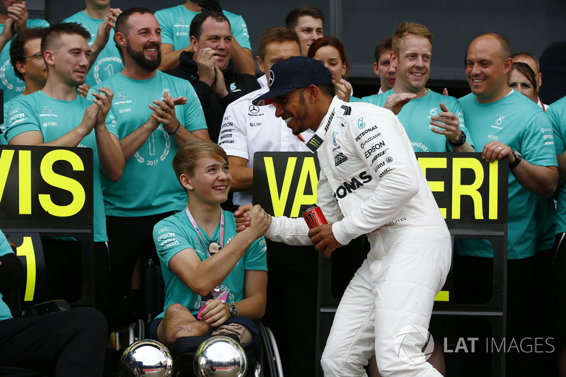 Race winner Lewis Hamilton, Mercedes AMG F1, celebrates with Billy Monger and the team