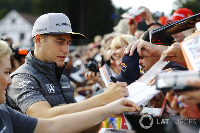 Stoffel Vandoorne, McLaren, signs autographs for fans