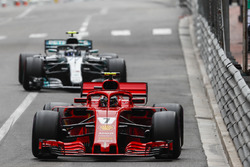 Kimi Raikkonen, Ferrari SF71H, leads Valtteri Bottas, Mercedes AMG F1 W09