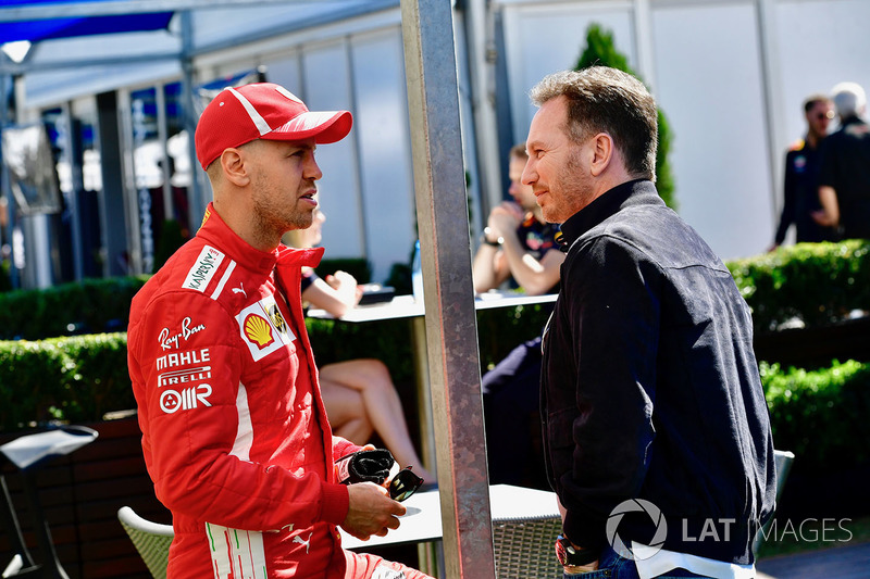 Sebastian Vettel, Ferrari talks with Christian Horner, Red Bull Racing Team Principal