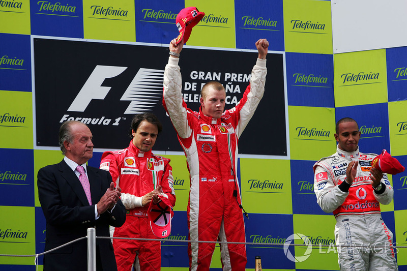 Podium: King Juan Carlos of Spain, race winner Kimi Raikkonen, Ferrari, second place Felipe Massa, Ferrari, and third place Lewis Hamilton,Mclaren on the podium