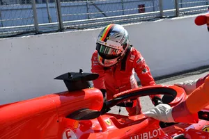 Sebastian Vettel, Ferrari pushes his car back in the pit lane