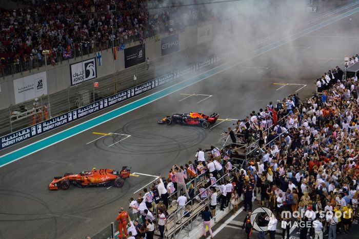 Charles Leclerc, Ferrari SF90 and Max Verstappen, Red Bull Racing RB15, 2nd position, celebrate with donuts