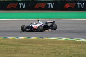 Mick Schumacher, Haas VF-21, heads to the pits with a broken front wing