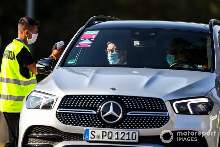 Ross Brawn, Managing Director of Motorsports, FOM gets heat checked on his way into the circuit
