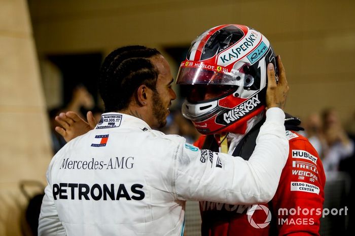 Lewis Hamilton, Mercedes AMG F1, 1st position, talks with Charles Leclerc, Ferrari, 3rd position, in Parc Ferme