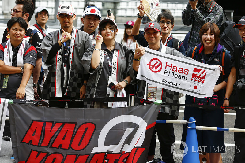 Fans with a banner for Ayao Komatsu, Chief Race Engineer, Haas F1 Team