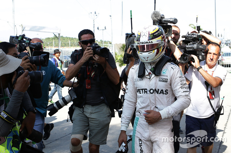 Lewis Hamilton, Mercedes AMG F1 returns to the pits after he retired from the race