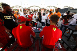 Sebastian Vettel, Ferrari, and Kimi Raikkonen, Ferrari, sign autographs for fans