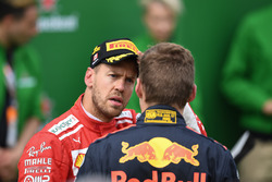 Sebastian Vettel, Ferrari and Max Verstappen, Red Bull Racing in parc ferme