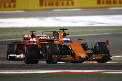 Fernando Alonso, McLaren MCL32, leads Sebastian Vettel, Ferrari SF70H