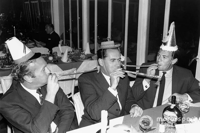 Colin Chapman, Jack Brabham and Jim Clark celebrate New Year's together