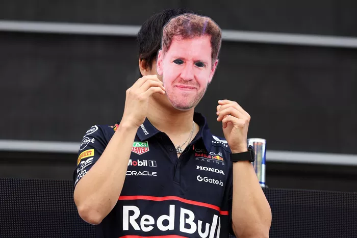 Yuki Tsunoda, Red Bull Racing Team wears a Sebastian Vettel face mask
