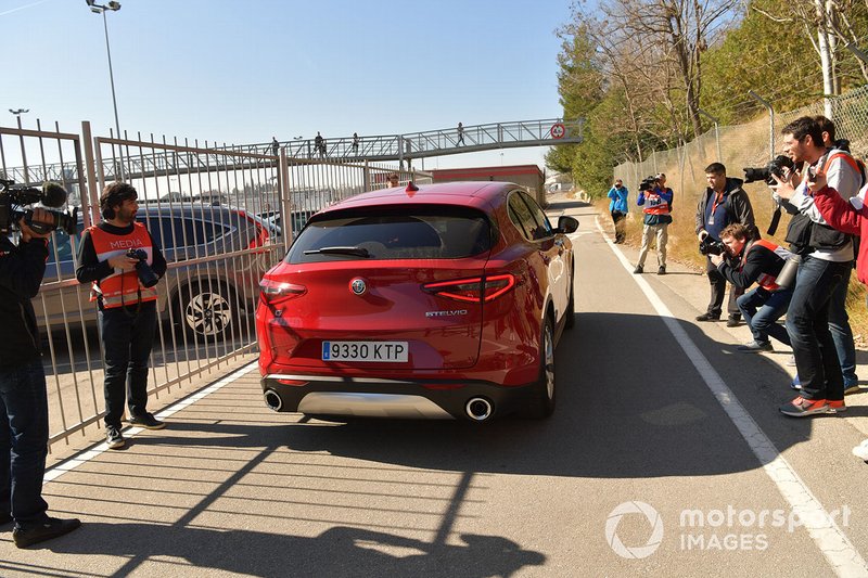 Alfa Romeo Stelvio leaves the Medical Centre and passes photographers