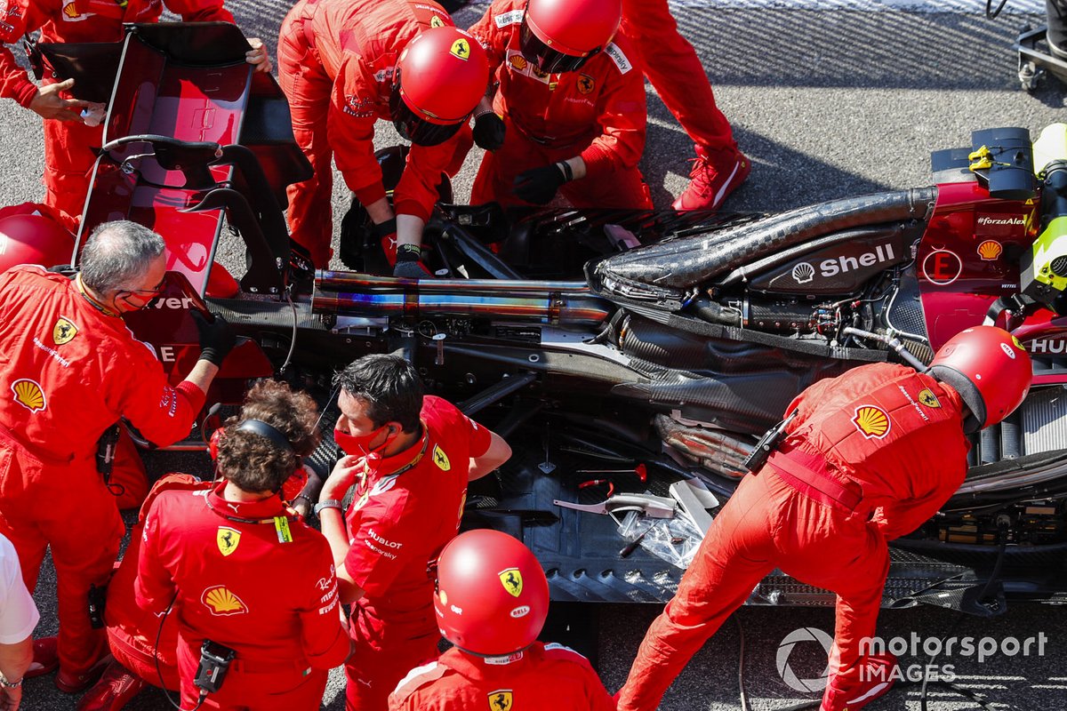 Ferrari mechanics at work on the grid