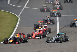 Daniel Ricciardo, Red Bull Racing RB12 and Nico Rosberg, Mercedes AMG F1 Team W07 lead at the start of the race