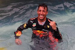 Race winner Daniel Ricciardo, Red Bull Racing celebrates in the Red Bull Racing Energy Station swimming pool