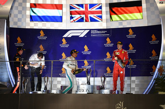 Max Verstappen, Red Bull Racing, Lewis Hamilton, Mercedes AMG F1 and Sebastian Vettel, Ferrari celebrate on the podium with the champagne