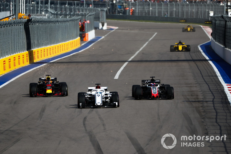 Marcus Ericsson, Sauber C37, leads Romain Grosjean, Haas F1 Team VF-18, and Daniel Ricciardo, Red Bull Racing RB14