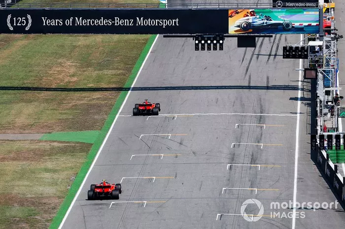 Sebastian Vettel, Ferrari SF90,  Carlos Sainz Jr., McLaren MCL34