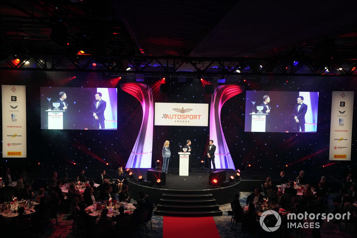 Presenters Nicky Shields and Will Buxton on stage with Christian Horner