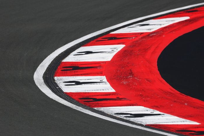 Mickey Mouse branding is seen on the trackside kerbs 