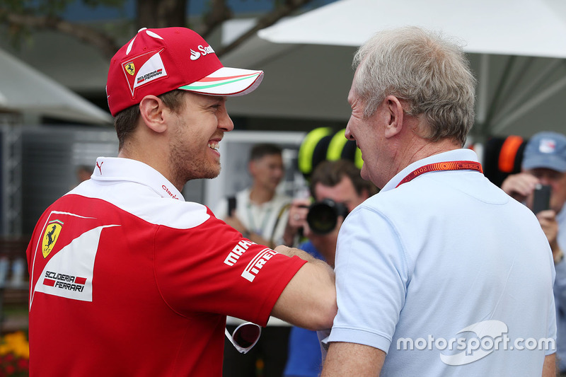 Sebastian Vettel, Ferrari with Dr Helmut Marko, Red Bull Motorsport Consultant