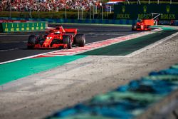 Sebastian Vettel, Ferrari SF71H, leads Kimi Raikkonen, Ferrari SF71H