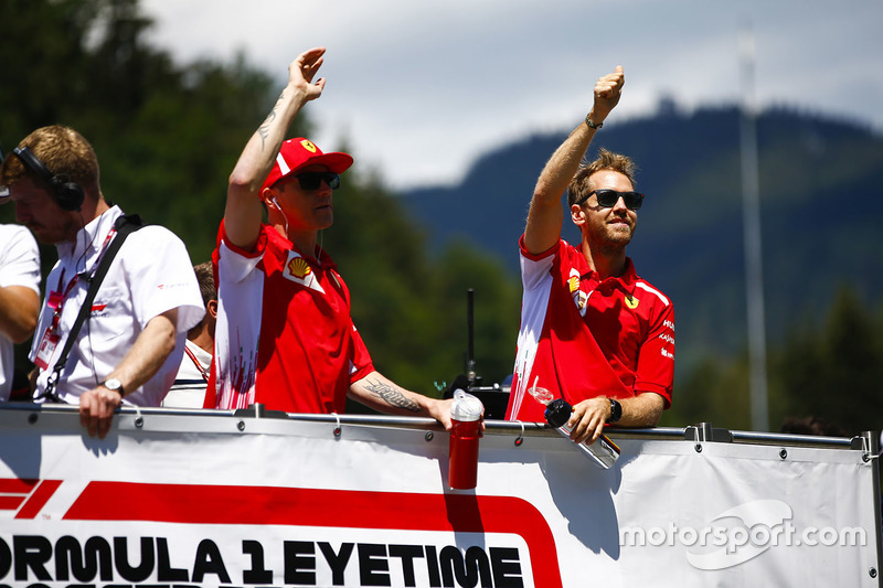 Kimi Raikkonen, Ferrari, and Sebastian Vettel, Ferrari, in the drivers parade