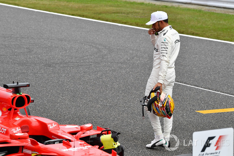 Lewis Hamilton, Mercedes AMG F1 looks at the Ferrari SF70H in parc ferme
