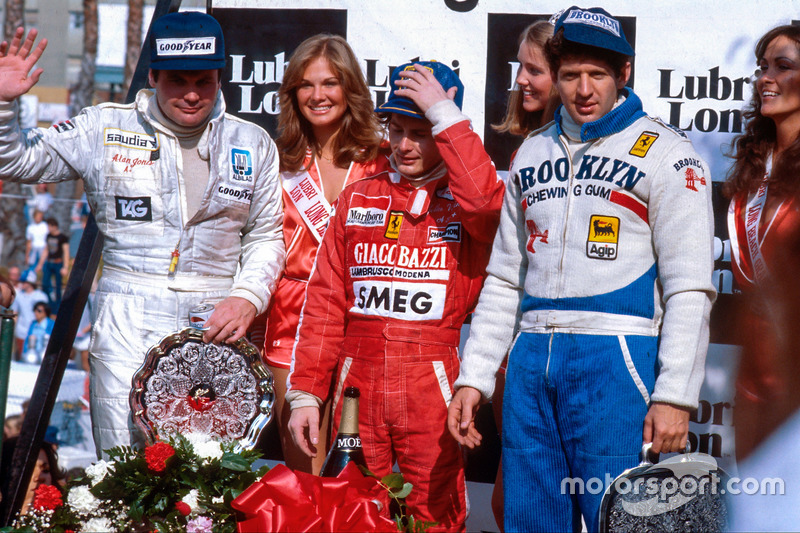 Gilles Villeneuve, 1st position, Jody Scheckter, 2nd position and Alan Jones, 3rd position on the po