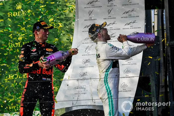 Max Verstappen, Red Bull Racing, 3rd position, sprays Valtteri Bottas, Mercedes AMG F1, 1st position, with Champagne