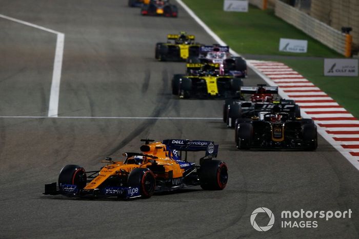 Carlos Sainz Jr., McLaren MCL34, leads Kevin Magnussen, Haas F1 Team VF-19, and Kimi Raikkonen, Alfa Romeo Racing C38