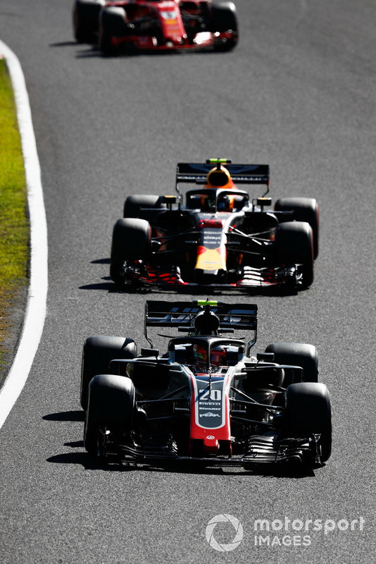 Kevin Magnussen, Haas F1 Team VF-18, leads Max Verstappen, Red Bull Racing RB14