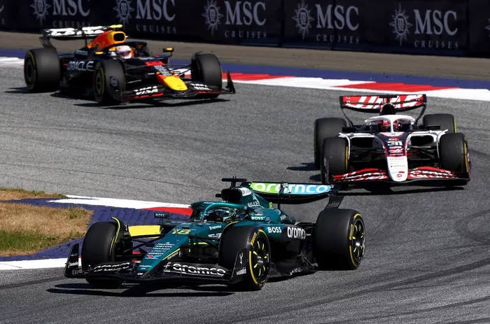 Lance Stroll, Aston Martin Racing, Esteban Ocon, Haas F1 Team