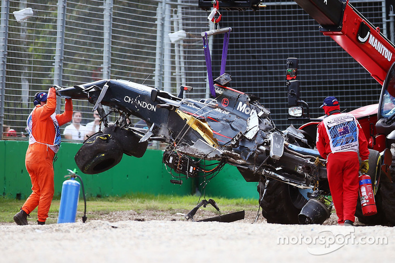 The McLaren MP4-31 of Fernando Alonso, McLaren is removed from the gravel trap after his race stopping crash